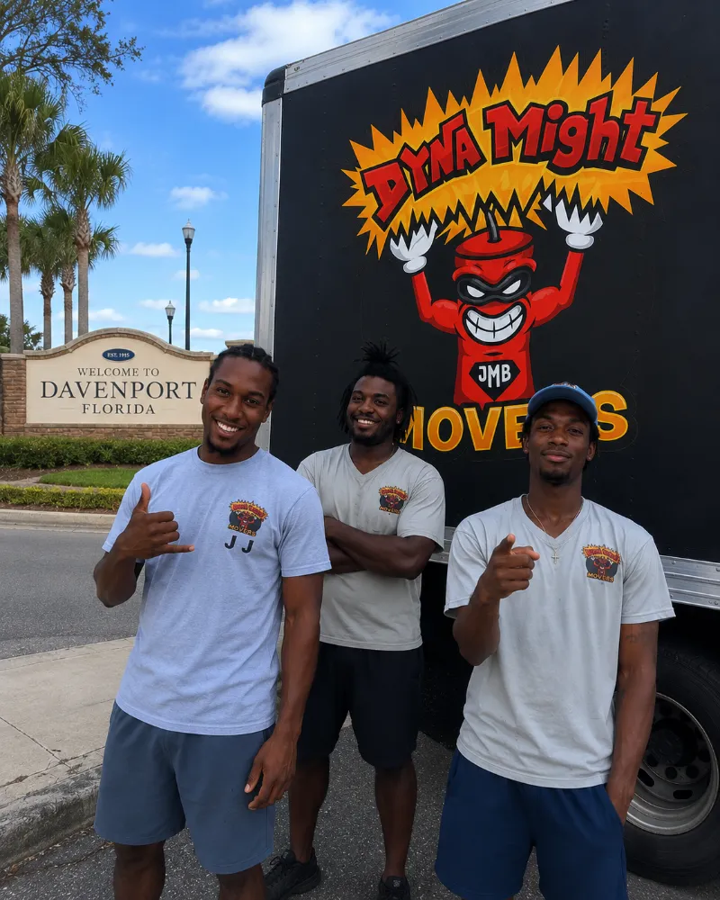 JJ and the DynaMight Movers crew posing in front of the Welcome to Davenport, Florida sign.
